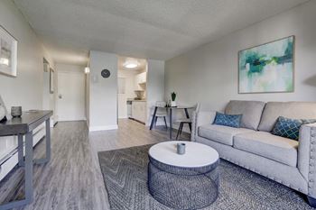 Hudson at highline apartments in denver, colorado model living room with wood-style plank flooring